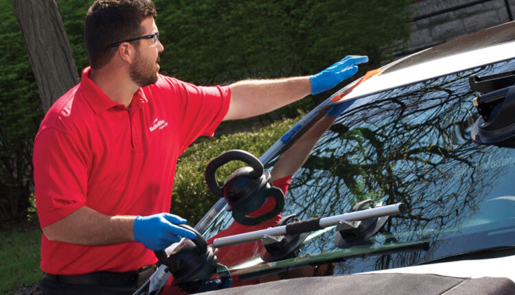 A person cleaning the car